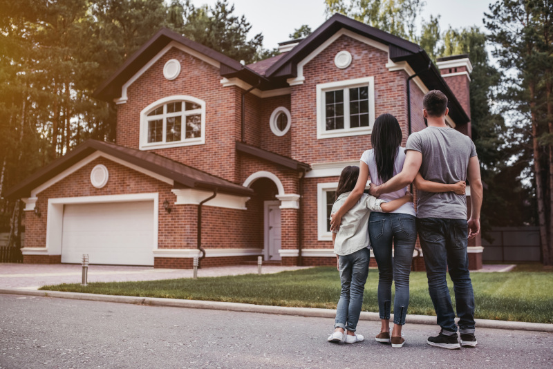 family looking at the house